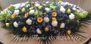 coffin-top-funeral-flowers-doncaster-hydes-florist-purples-yellow  